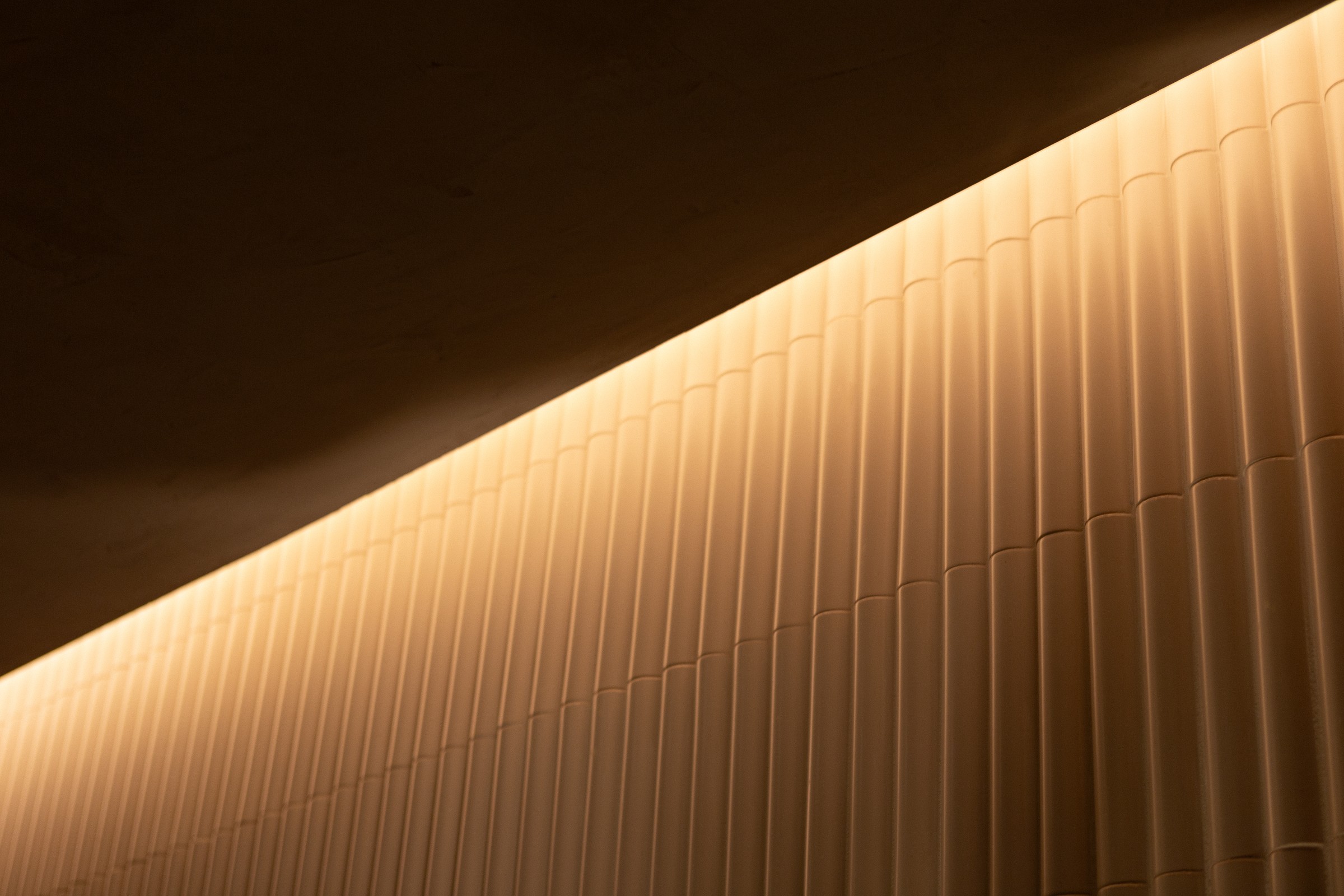 Diagonal light on ribbed wall, graphic