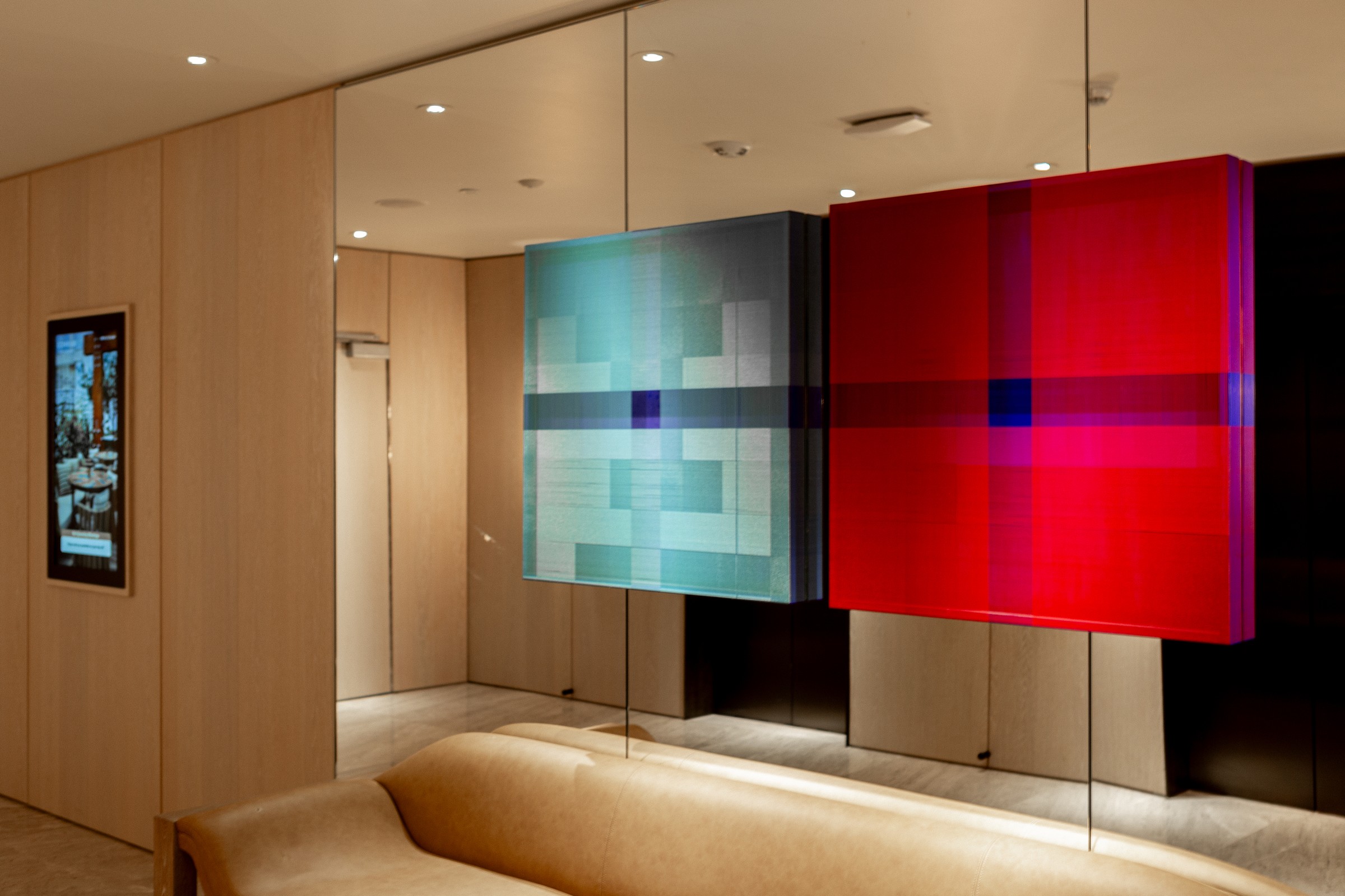 Red and blue art diptych, room context