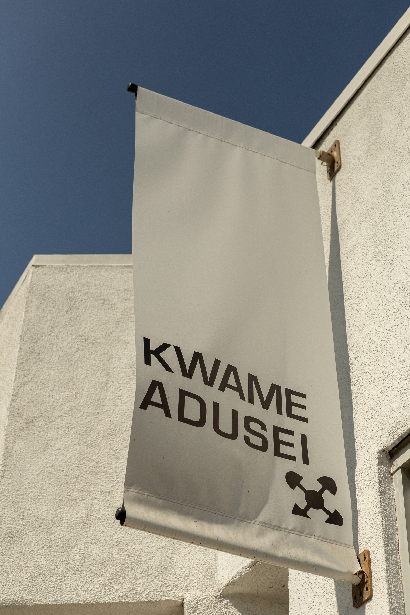 Flag signage against sky