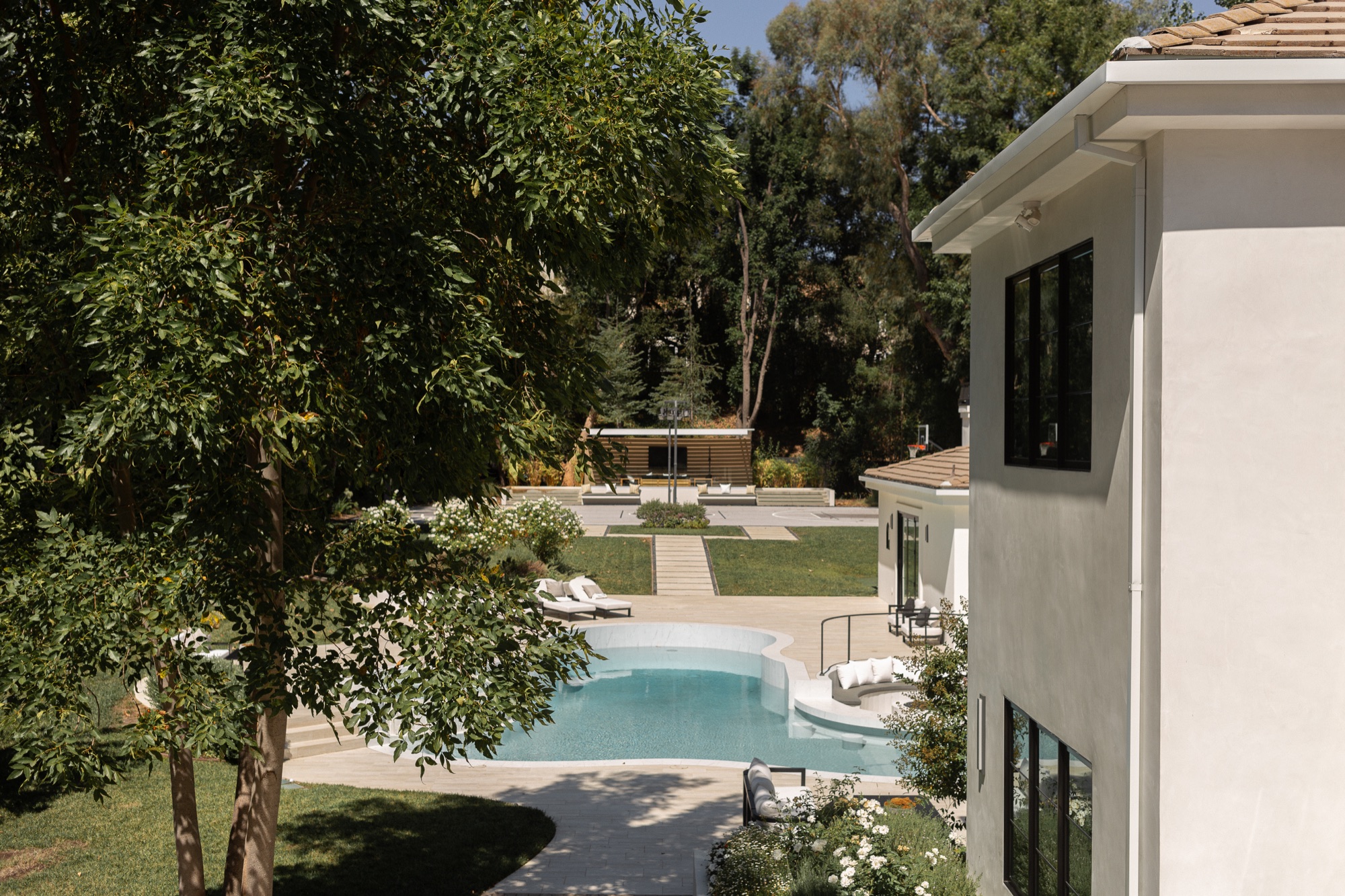 Side yard, pool running the length of the house