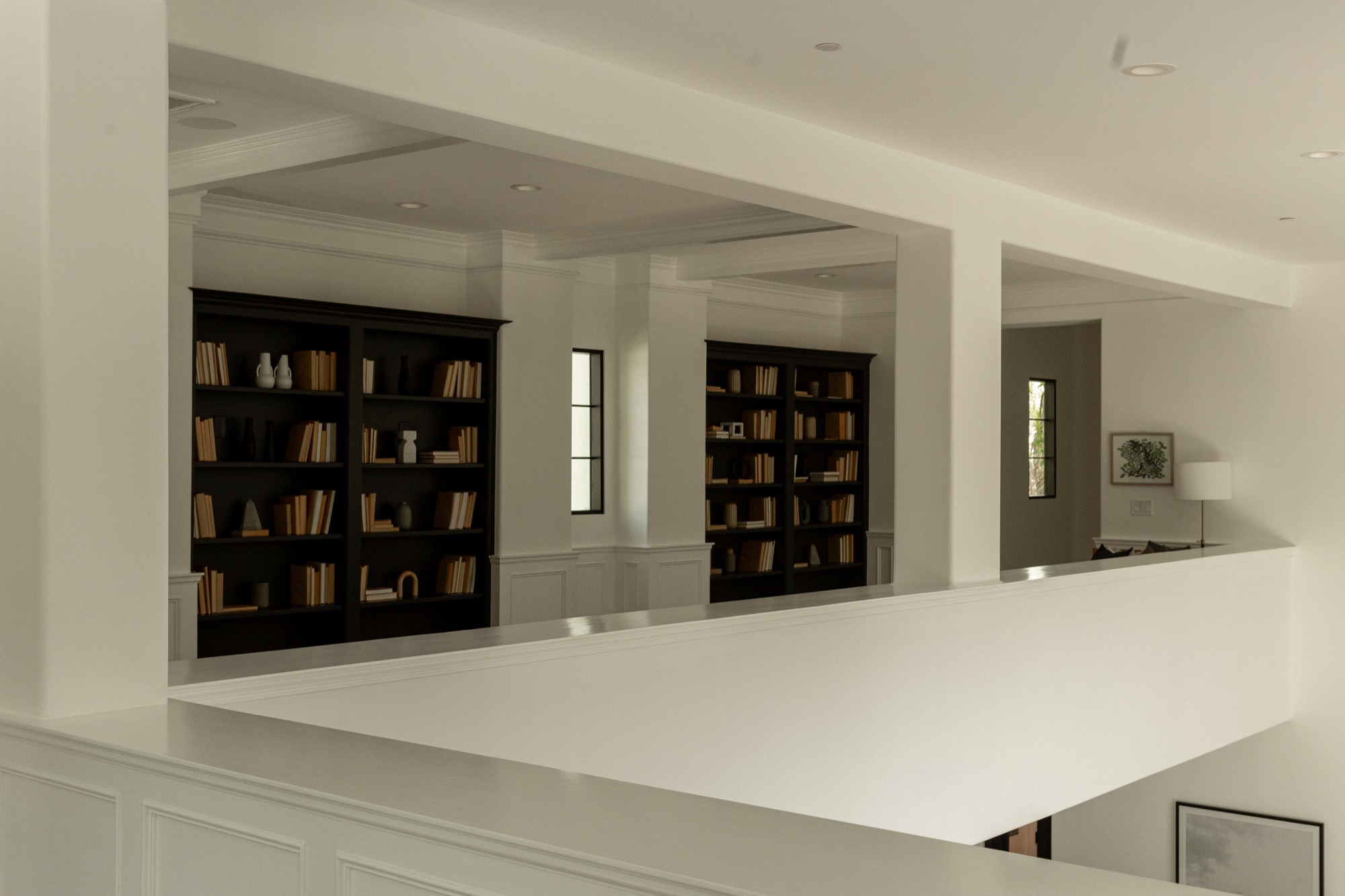 Upper landing, library with built-in bookshelves